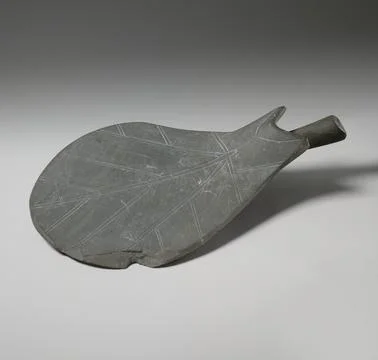 Dish in the shape of a leaf ca. 31002900 B.C. Early Dynastic Period. Dish i.. Stock Photos
