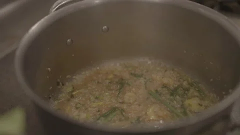 Dish simmering in large pot Stock Footage 335703251