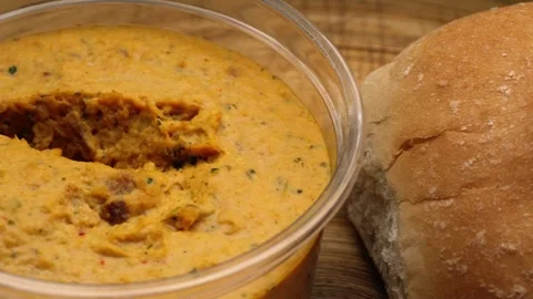 Dish of spicy fresh hummus macro Stock Footage 283478657