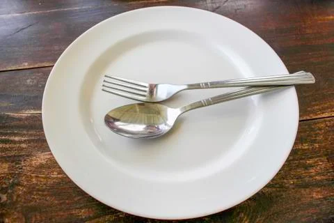 Dish with spoon Stock Photos