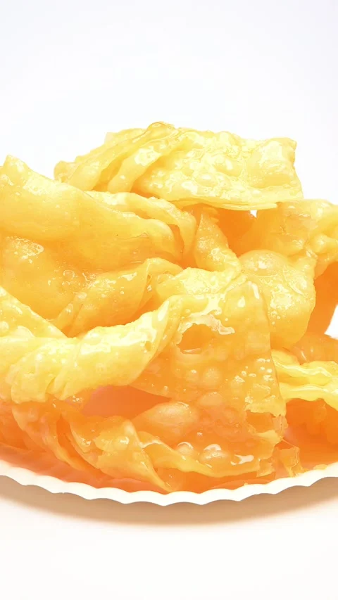 Dish of sweet egg break rotating on white at vertical composition Stock Footage 315320972