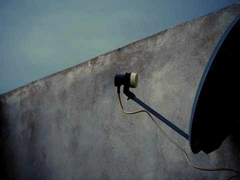 Dish Tv setup isolate on sky wall background on closeup shot Fotos de archivo