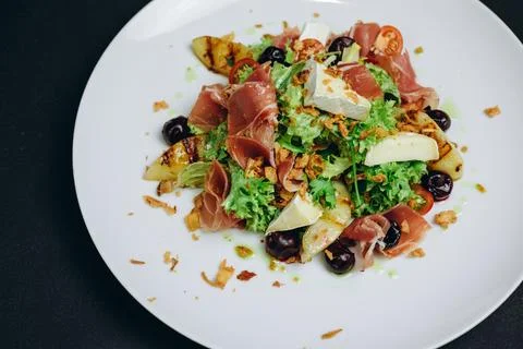 The dish which includes meat and fish is served to the customers of the res.. Stock Photos