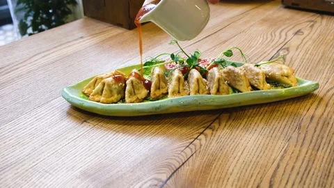 Dish on which sauce is poured on top Video stock 169966123