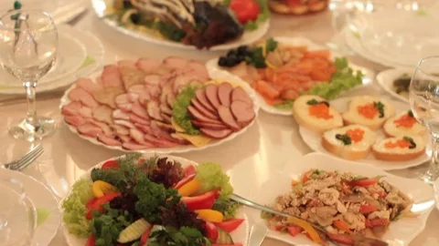 Dishes with an appetizing cold snack on the festive table in the restaurant. Stock Footage 79617864