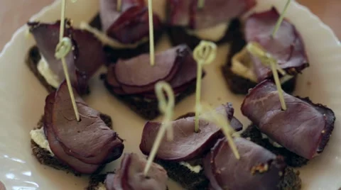 Dishes with beef canapes and vegetable sandwiches, the camera moves smoothly. 스톡 동영상 66557919