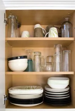 Dishes in the Cupboard Stock Photos