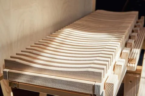 Dishes drying rack made of solid ash timber near plywood cabinet Stock Photos