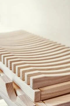 Dishes drying rack made of solid ash timber near plywood cabinet Stock-Fotos