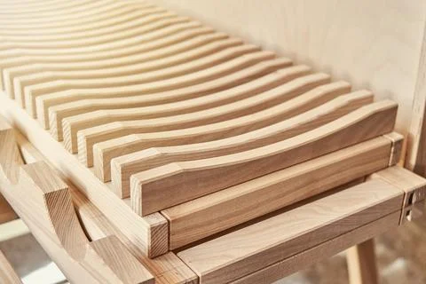 Dishes drying rack made of solid ash timber near plywood cabinet Stock Photos