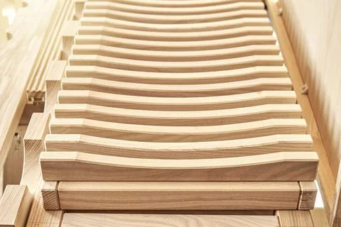 Dishes drying rack made of solid ash timber near plywood cabinet Stock Photos