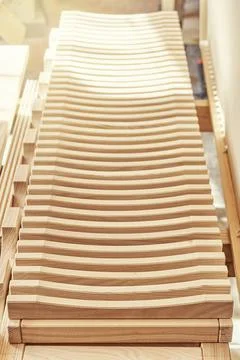 Dishes drying rack made of solid ash timber near plywood cabinet Stock Photos