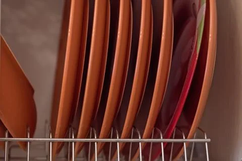 Dishes in kitchen cupboard Foto stock