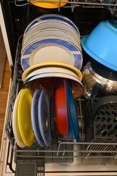 Dishes loaded in a dishwasher Fotos Stock