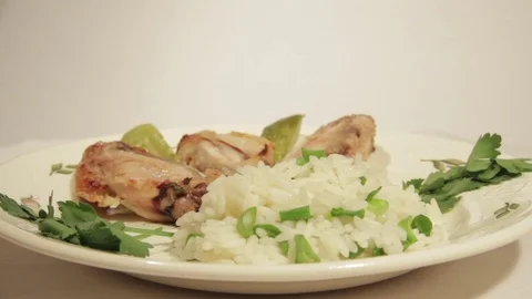Dishes portion from chicken wings with rice Stock Footage 70994012