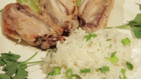 Dishes portion from chicken wings with rice Stock Footage 70994089