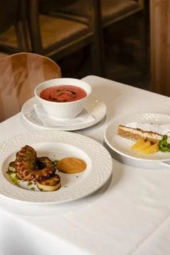 Dishes Served on White Tablecloth Stock Photos