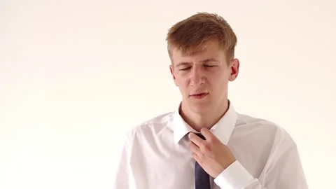 Disheveled worker guy in a white shirt, showing the OK sign, puts on glasses Stock Footage 134589529