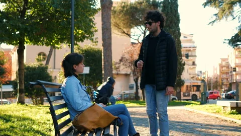 Dishonesty, deception - young thief asks a girl to light and steals her purse Stock Footage 147309633