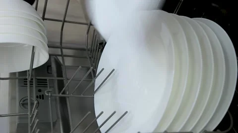 Dishware inside built-in dishwasher. Dishwashing machine rack Stock Footage 167795447
