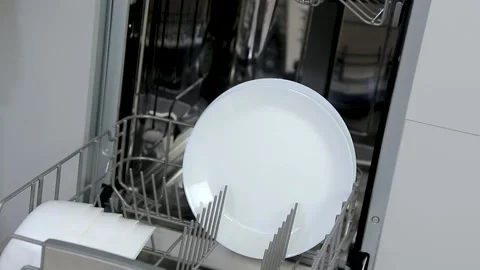 Dishware inside built-in dishwasher. Dishwashing machine rack Stock Footage 167795448