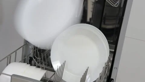 Dishware inside built-in dishwasher. Dishwashing machine rack Stock Footage 185373492