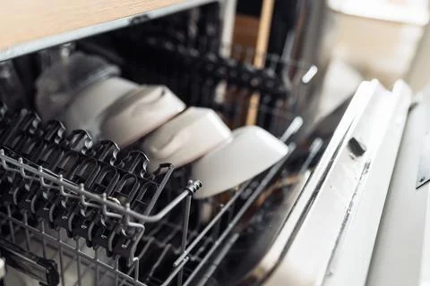 Dishwasher with clean dishes Fotos de archivo