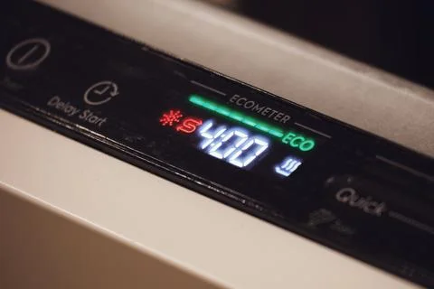 Dishwasher control panel showing startup warnings. Close-up of dishwasher d.. Stock-Fotos