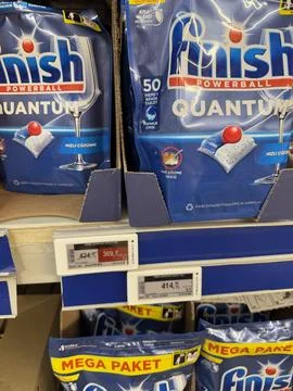 Dishwasher detergent packages on store shelf, showing prices and quantity Stock Photos