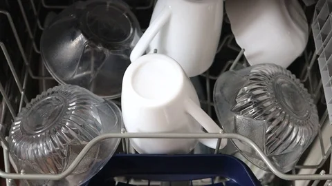 Dishwasher with the dishes, loading the dishwasher Stock Footage 124859252