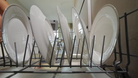 The dishwasher door opens where the washed dishes stand Stock Footage 251446271