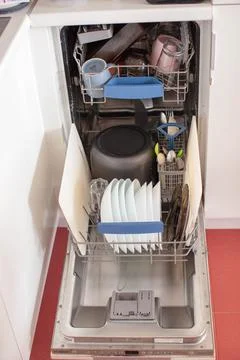 Dishwasher, order in the house. Kitchen interior. Stock Photos