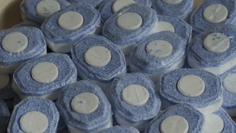Dishwasher tablets background rotating macro. Detergents concept Stock Footage 285293005