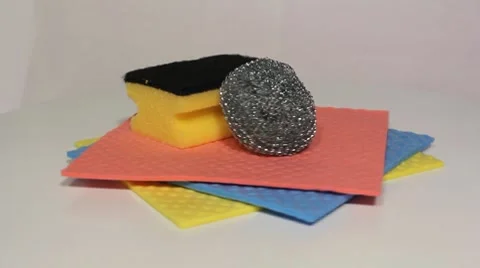 Dishwashing cloths and sponges rotating Stock Footage 7731253