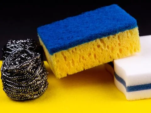 Dishwashing concept. On a black background, different washcloths and scrubber Foto stock