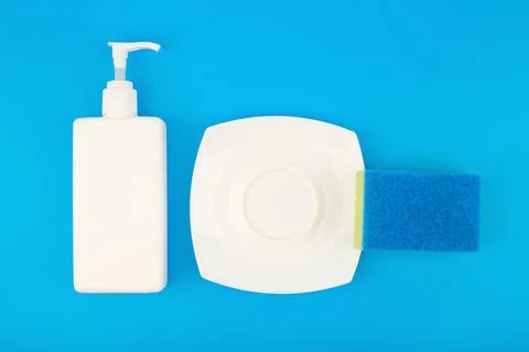 Dishwashing concept, high angle view of detergent, cleaning sponge and clean Stock Photos