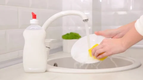 Dishwashing detergent on the background of the kitchen Stock Footage 234932713