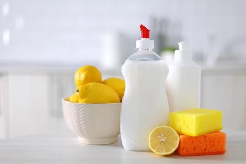Dishwashing detergent on the background of the kitchen Stock Photos