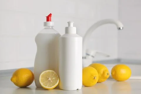 Dishwashing detergent on the background of the kitchen Stock Photos