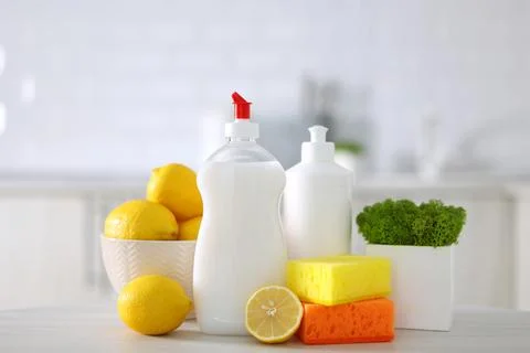 Dishwashing detergent on the background of the kitchen Stock Photos