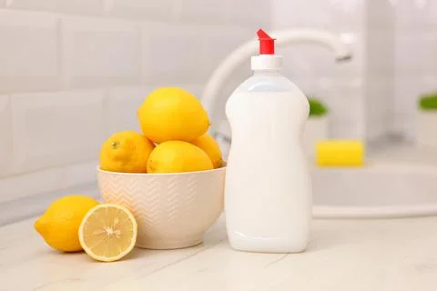 Dishwashing detergent on the background of the kitchen Stock Photos
