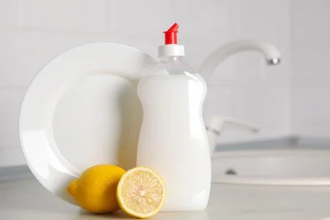 Dishwashing detergent on the background of the kitchen Stock Photos