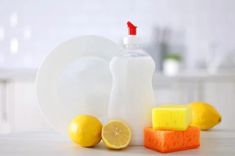 Dishwashing detergent on the background of the kitchen Stock Photos