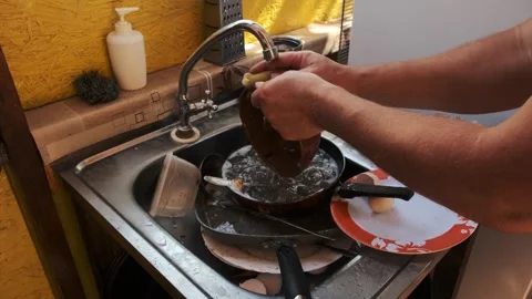 Dishwashing in Kitchen Sink Stock Footage 303415465
