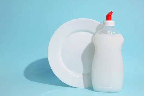 Dishwashing liquid on a colored background Stock Photos