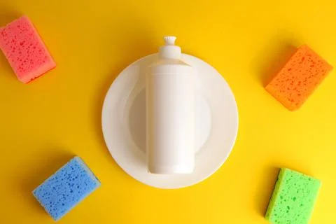 Dishwashing liquid on a colored background Stock Photos
