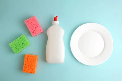 Dishwashing liquid on a colored background Stock Photos