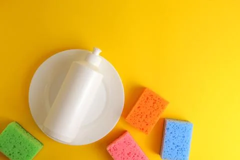 Dishwashing liquid on a colored background Foto stock