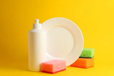 Dishwashing liquid on a colored background Foto stock