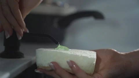 Dishwashing liquid dripping on sponge in kitchen close-up Stock Footage 314308794